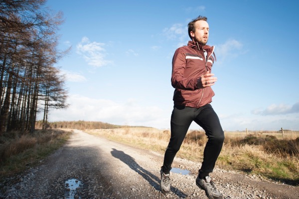 Sport injury treated by Hosford Health Clinic osteopath; jogging man on trail